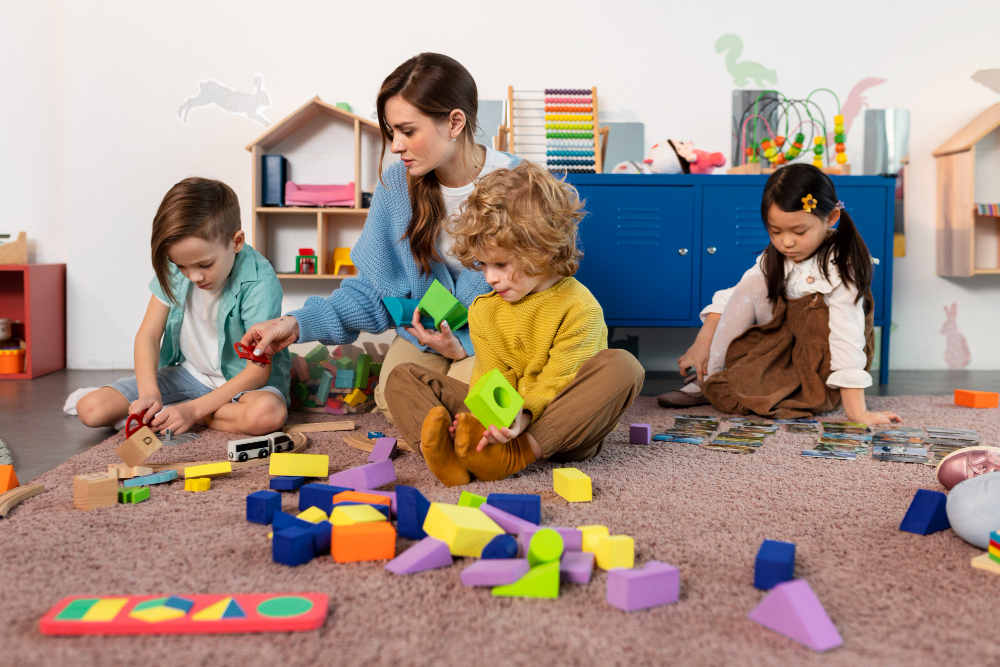 Daycare center staff with children in a safe and well-equipped play area